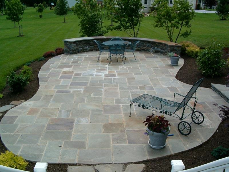 Adding stone patio designs to your backyards can give it a more relaxed and creative vibe. [Image Credit: Home Epiphany]